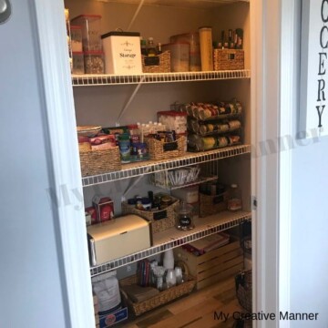 A food pantry that has wire shelves and is very organized.