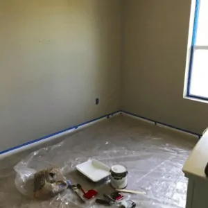 Bedroom that is prepped to be painted. 