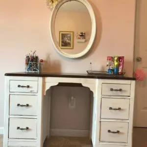 Pained Desk and Mirror in a bedroom.
