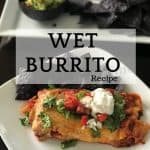 Wet burrito with blue tortilla chips on a white plate.