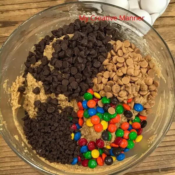 Chocolate, peanut butter morsels and M&M's in the batter to these giant cookies.