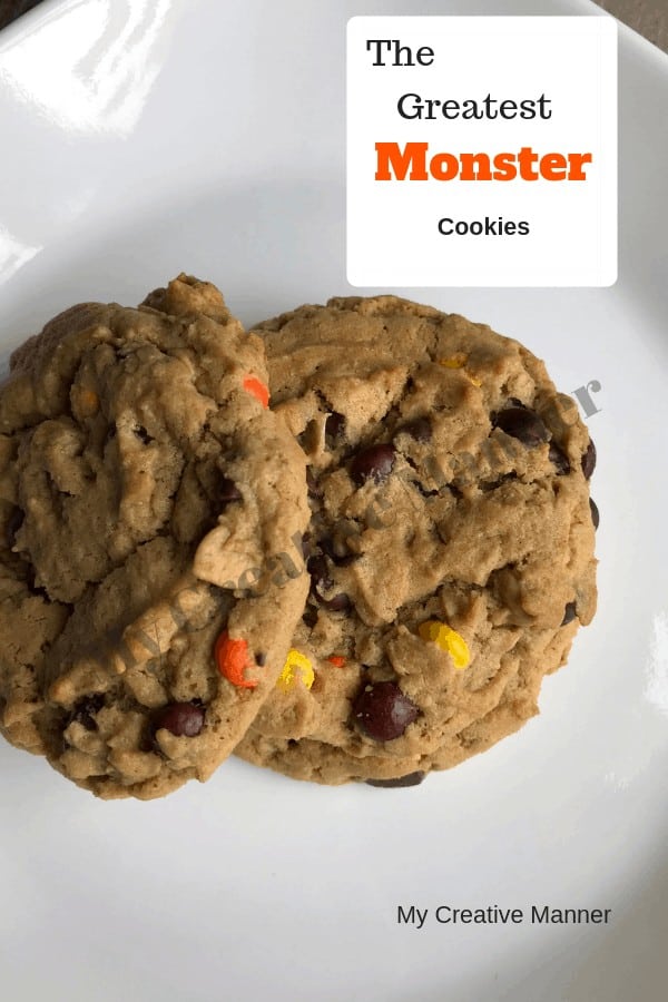 Two Monster Cookies on a white plate.