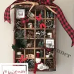 Antique Coke crate that is filled with many small Christmas decorations.