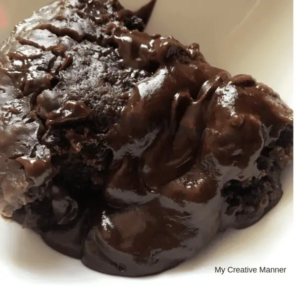 Chocolate lava cake in a white bowl.