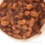 White bowl filled with baked beans