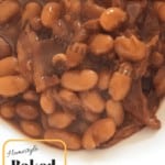 Baked beans on a white plate with the words Homestyle Baked Beans down in the lower left corner.
