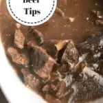 White bowl filled with beef tips and gravy.