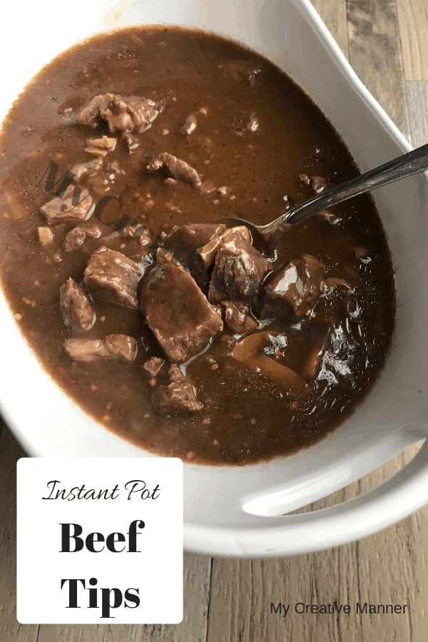 A white bowl filled with beef tips and gravy that was made in the Instant Pot.