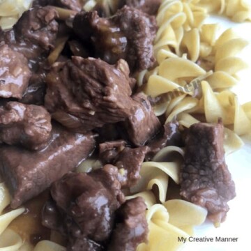 Beef tips and gravy over egg noodles.