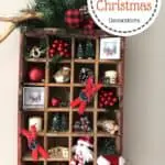 Wooden Coke crate that is filled with Christmas decorations. Top right corner has the words Wooden Coke Crate Christmas Decorations in a circle.