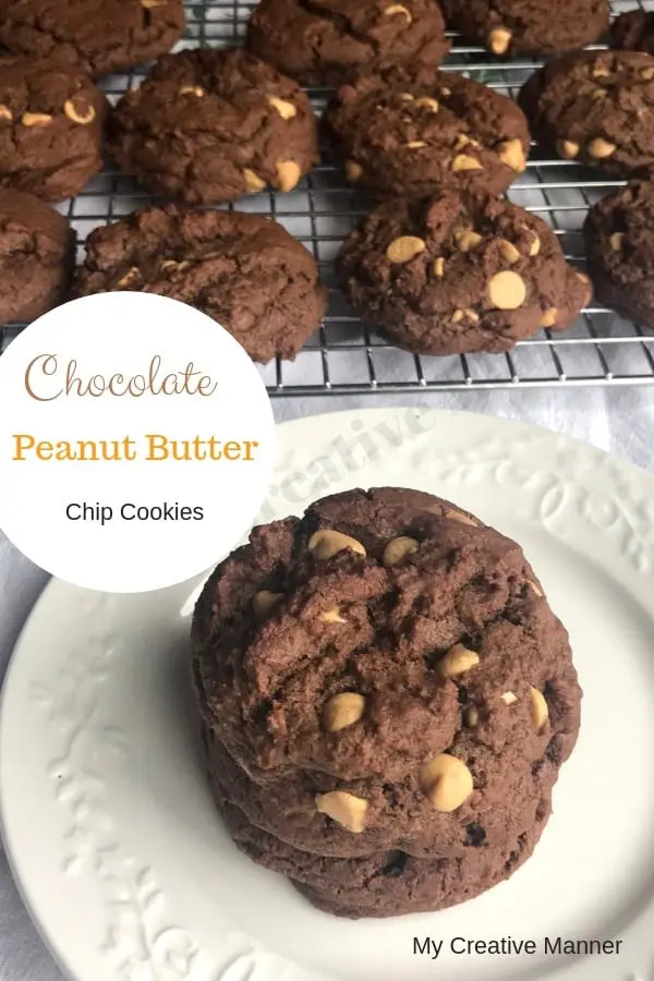 white plate that has three chocolate peanut butter cookies and peanut butter chips on it and a cooling rack with more cookies on it. 