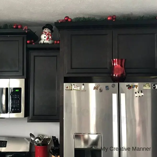 Christmas Cookie Jars on top of cupboards.