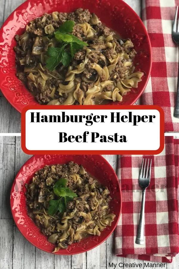 Red bowl filled with Hamburger Helper Beef Pasta with a red and white napkin next to the bowl with a fork on the napkin.