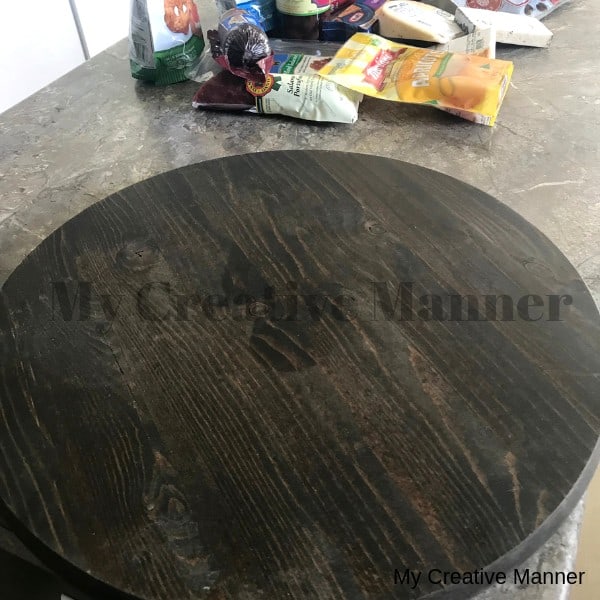 Round wood board on a counter top.