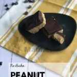 Grey plate has two peanut butter bars on it. The plate is sitting on a white and yellow napkin with chocolate chips around it. With the words in a square box at the bottom of the page that reads. No Bake Peanut Butter Bars My Creative Mnaner