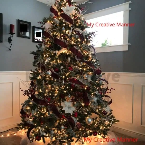 Christmas tree that is all lite up at night.