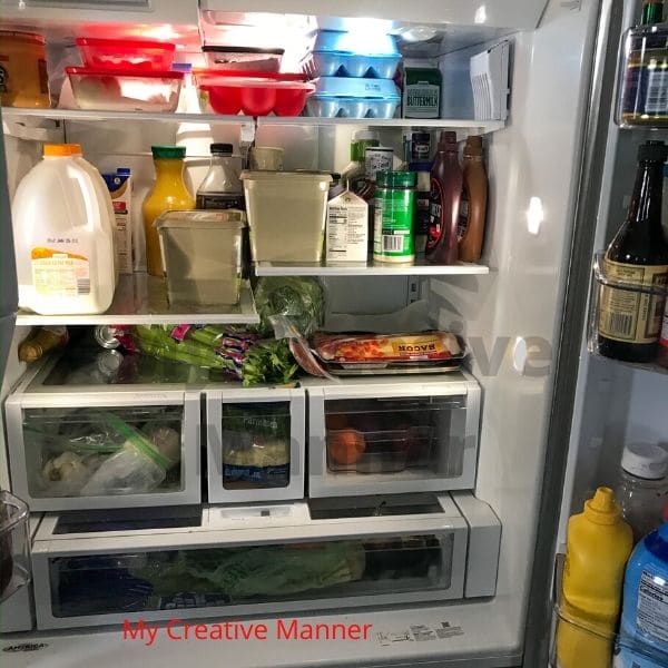A messy refrigerator before it gets organized.
