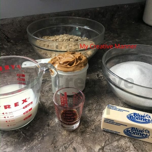 The ingredients needed to make no bake cookies. Milk, butter, sugar, peanut butter, old fashioned oats. 