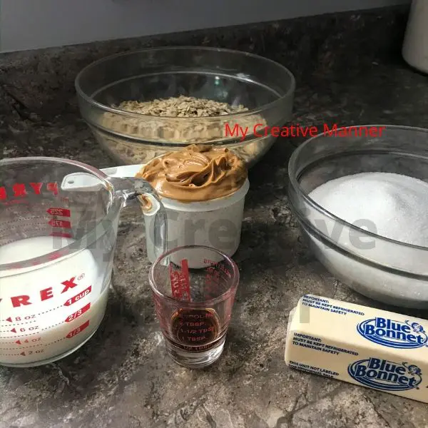 The ingredients needed to make no bake cookies. Milk, butter, sugar, peanut butter, old fashioned oats.