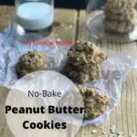 Three peanut butter no bake cookies on wax paper with a glass of milk and a jar with more cookies in it. With the words No-Bake Peanut Butter Cookies in a circle at the bottom left of the image.