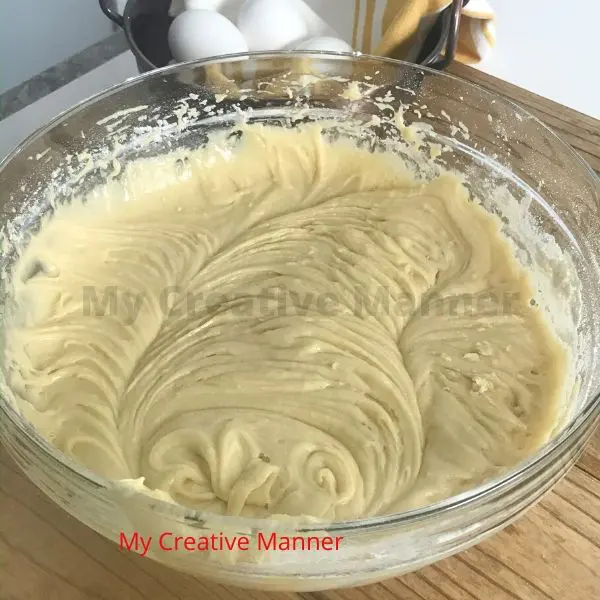 Cake batter in a clear bowl.