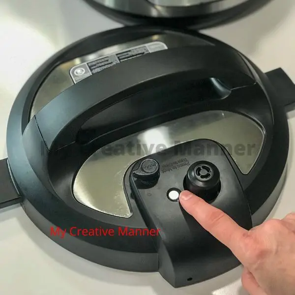 Showing the metal valve of an Instant Pot.