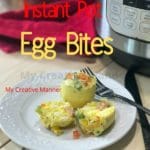 A white plate with omelette bites on it, a fork and knife is next to the plate. Behind the plate is a red towel and a pressure cooker. The words Instant Pot Egg bites are at the top of the image.