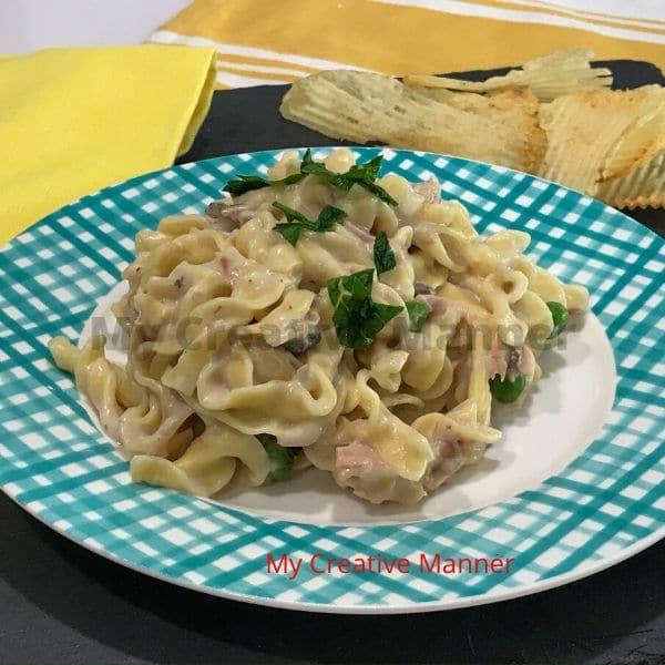 A simple recipe for tuna noodle casserole that is on a plate.
