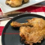 Instant Pot chicken leg quarter that is on a grey plate.