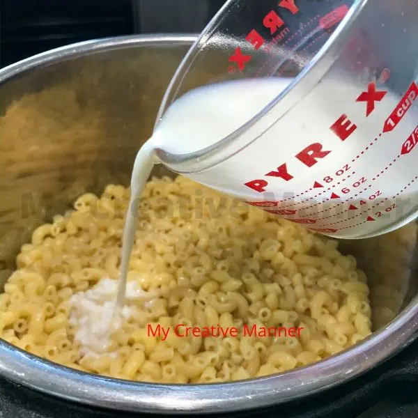 Milk being pour into the noodles.
