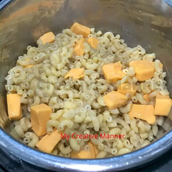 Cheese being melted into the noodles.