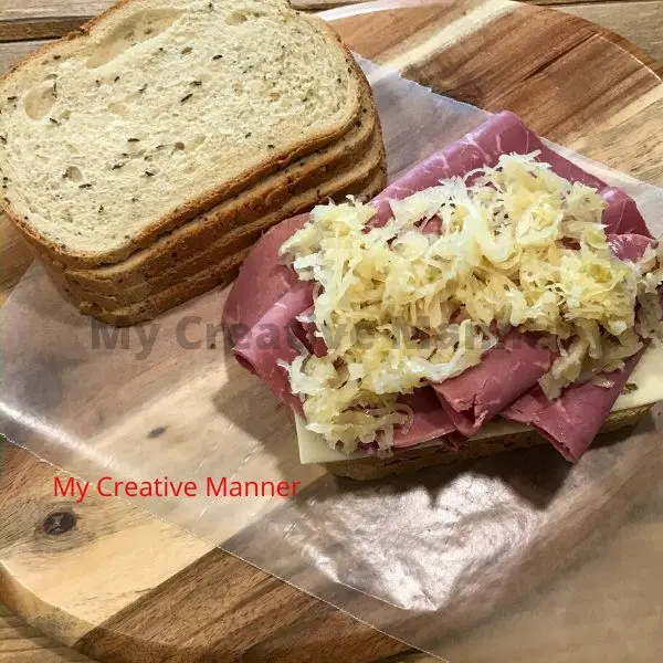 Sauerkraut on top of the corned beef.