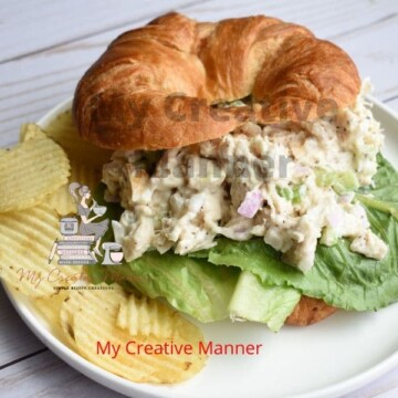 Chicken Salad Sandwich on a plate with chips.