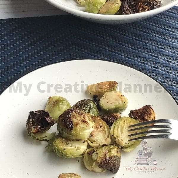 Sprouts on a plate with a fork.