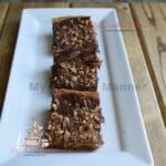 Three Blondies brownies on a white plate.