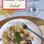 Easy to make Italian Pasta Salad on a white plate with a fork.