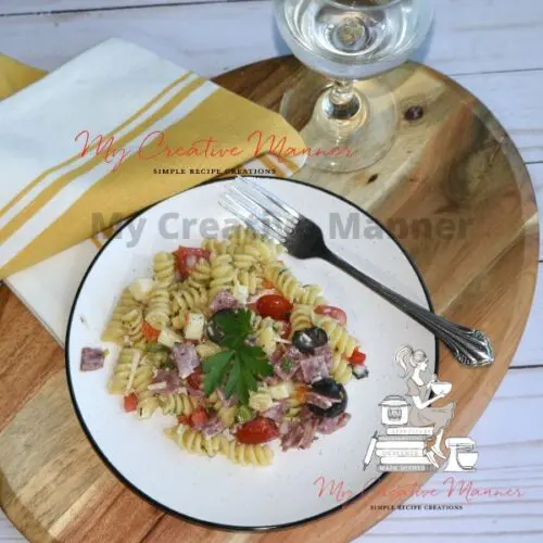 Italian pasta salad on a white plate.
