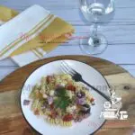 Classic Italian pasta salad recipe on a white plate.