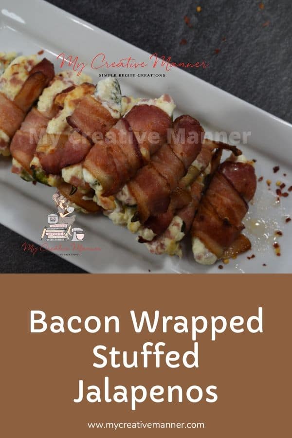 Bacon Wrapped Stuffed Jalapenô on a white plater.