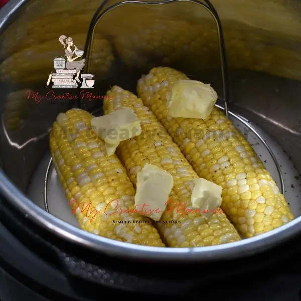 Sweet corn in the inner pot of an Instant Pot.