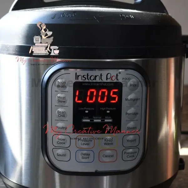 The front of an Instant Pot with a count down of five minutes.