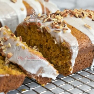 The best pumpkin bread with glaze recipe on a cooling rack.