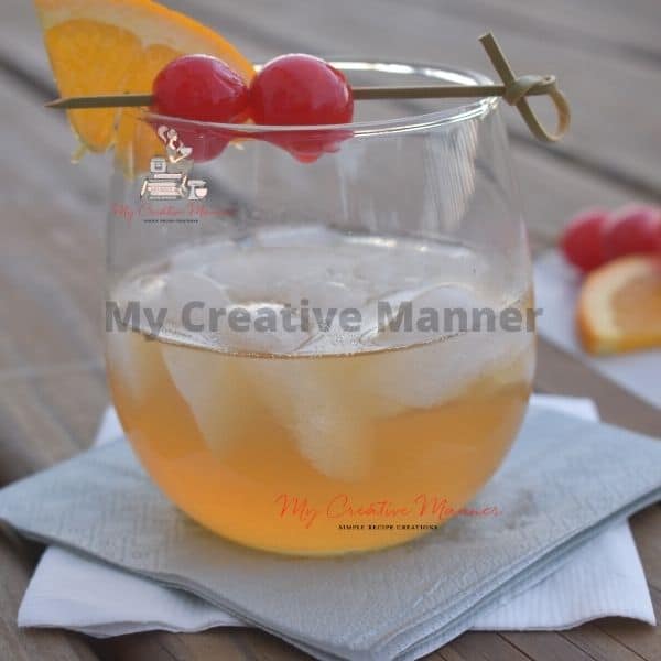 Whiskey Sour cocktail in a glass with napkins under it.