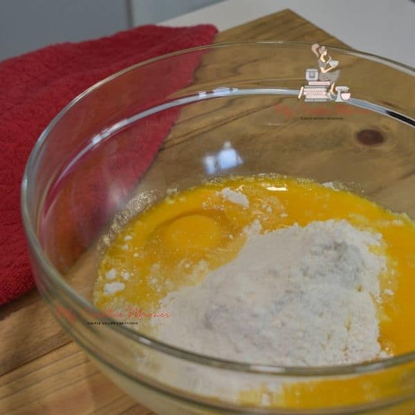 Eggs, melted butter, and cake mix in a mixing bowl.