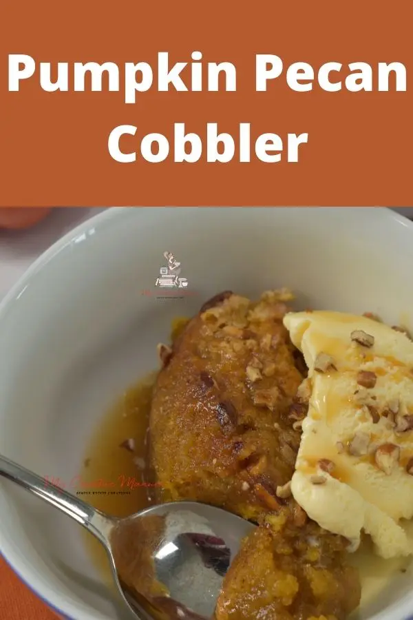 Pecan cobbler in a bowl with ice cream.