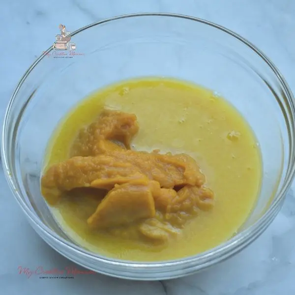 Pumpkin puree in a bowl with melted butter.