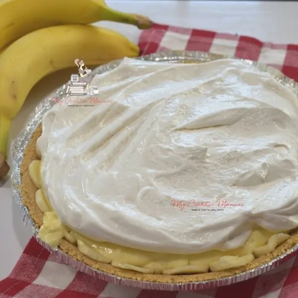 Cool whip topping the banana cream pie.