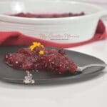A side dish recipe for cranberry sauce on a plate.