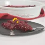 A side dish recipe for cranberry sauce on a plate.