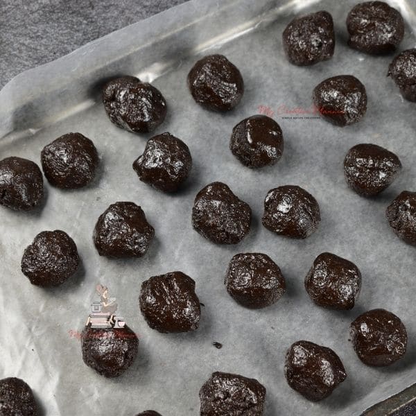 The balls all formed on a waxed paper lined cookie sheet pan.